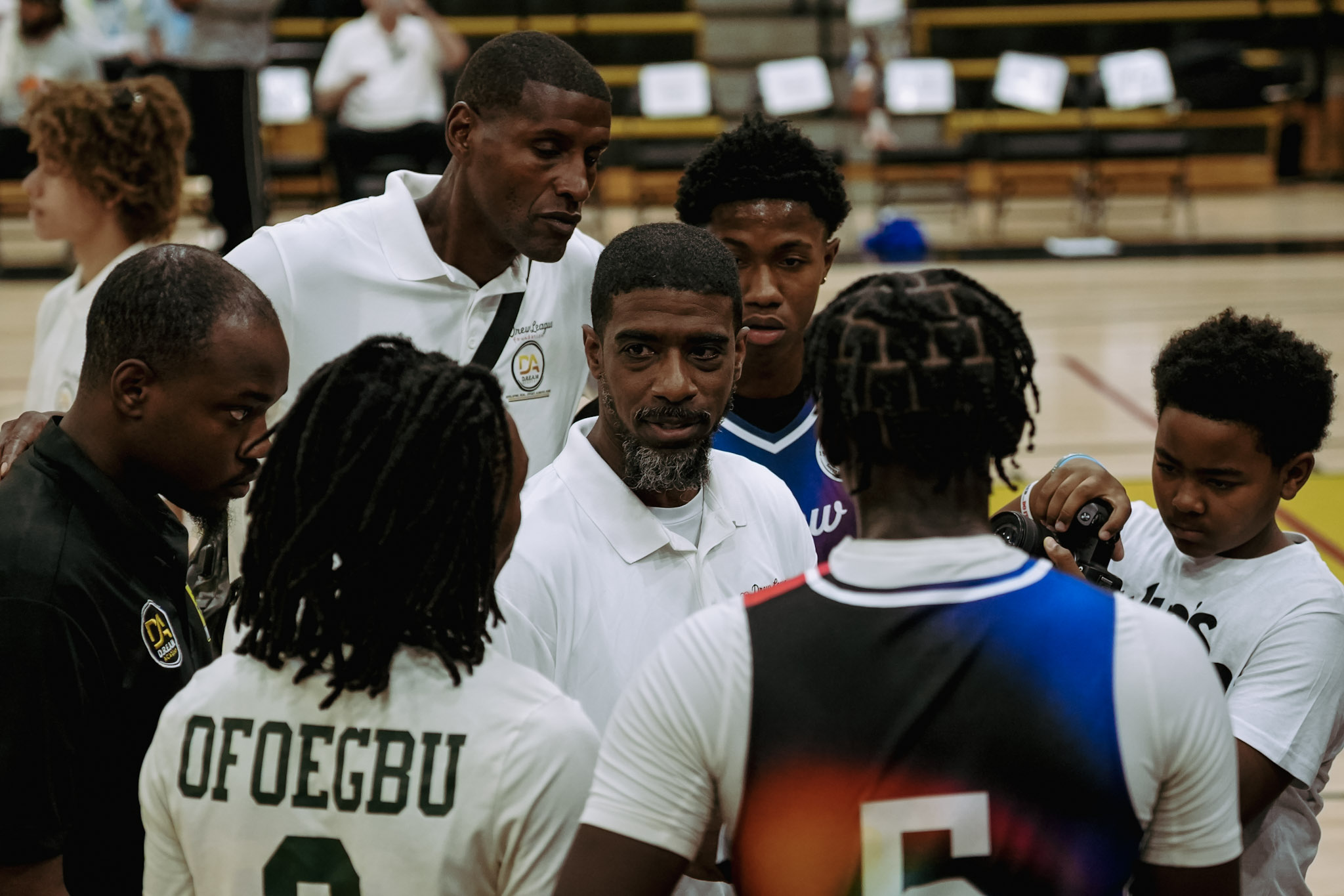 Coach Jay mentoring one of the players during Drew League 2025